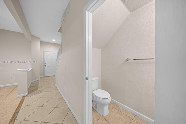 bathroom with tile patterned flooring and toilet