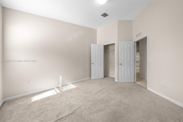 unfurnished bedroom with light carpet