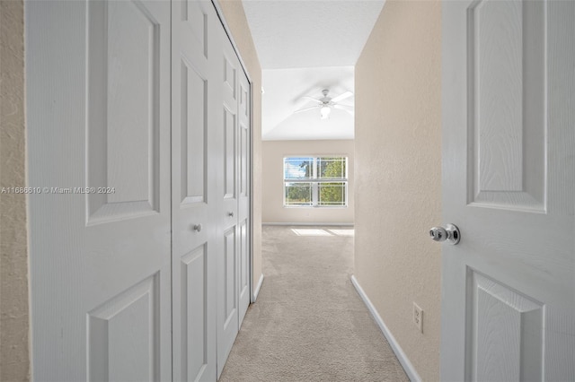 hallway featuring light carpet