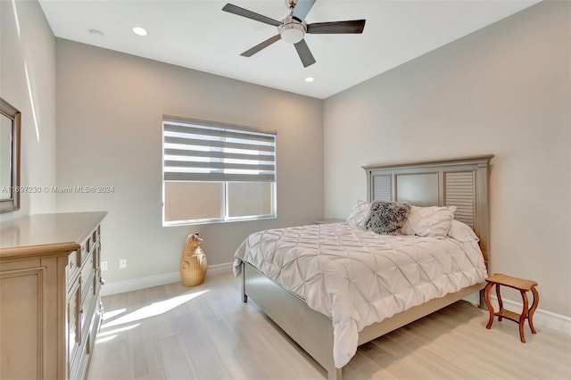 bedroom featuring ceiling fan and light hardwood / wood-style floors