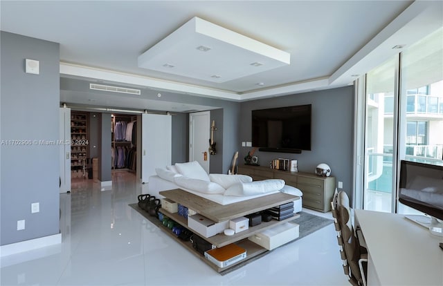 tiled living room featuring a barn door