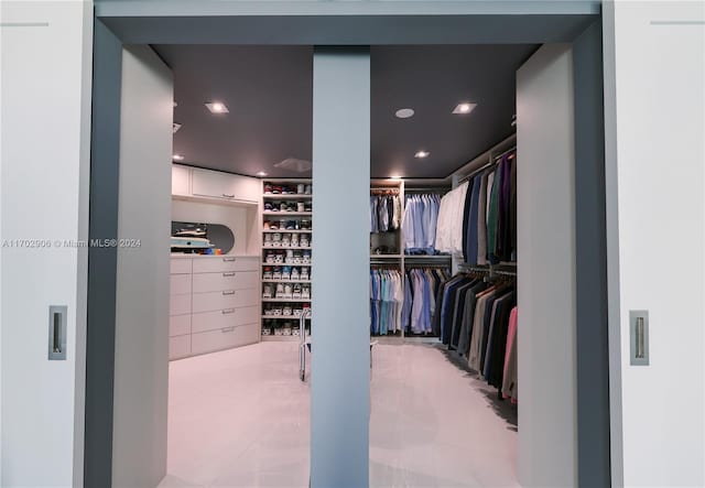 walk in closet featuring light tile patterned floors