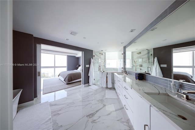 bathroom featuring vanity, an enclosed shower, and a wealth of natural light