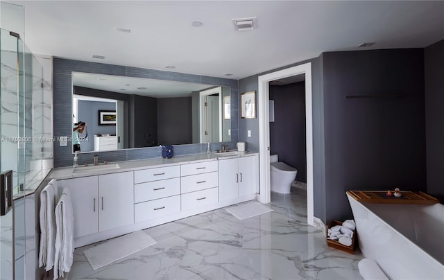 bathroom featuring an enclosed shower, vanity, and toilet