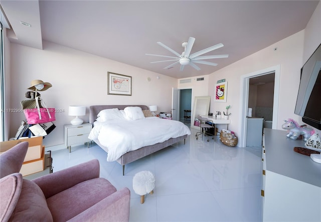 tiled bedroom featuring ceiling fan