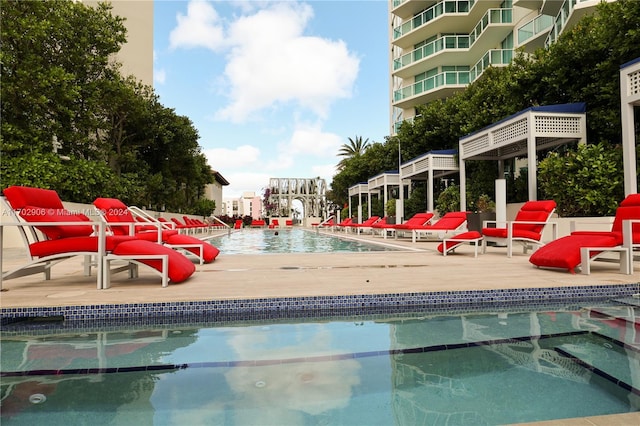 view of swimming pool with a patio area