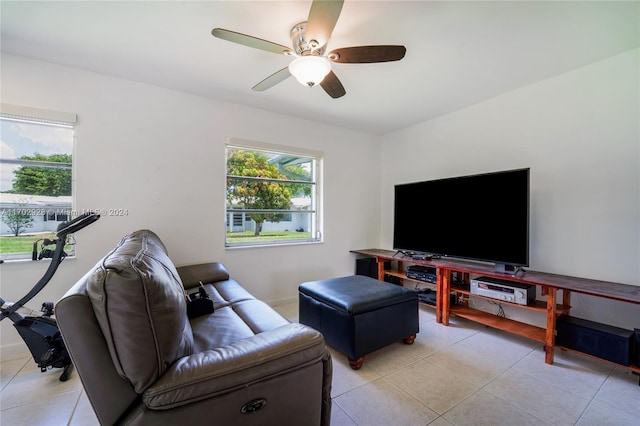 living room featuring ceiling fan and light tile patterned floors