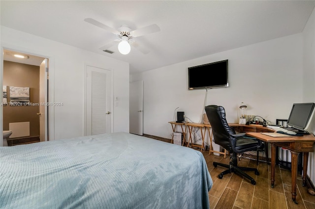 bedroom with hardwood / wood-style flooring and ceiling fan