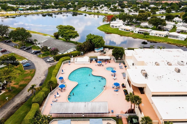 drone / aerial view with a water view