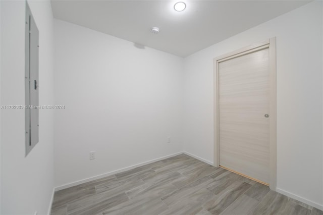 spare room with light wood-type flooring