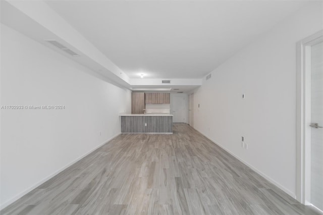 unfurnished living room featuring light hardwood / wood-style floors