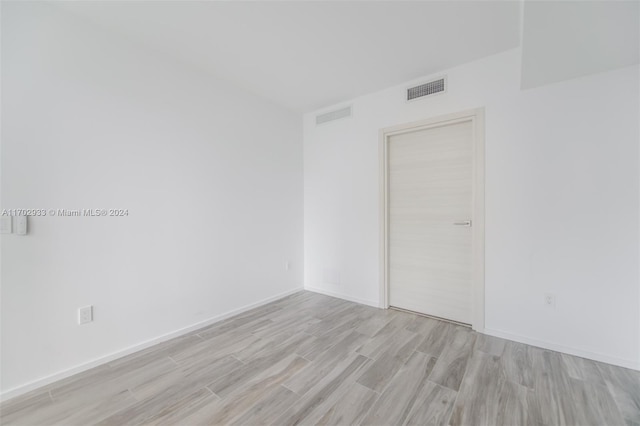 empty room with light wood-type flooring