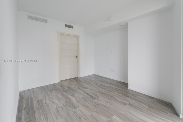 unfurnished room featuring light wood-type flooring