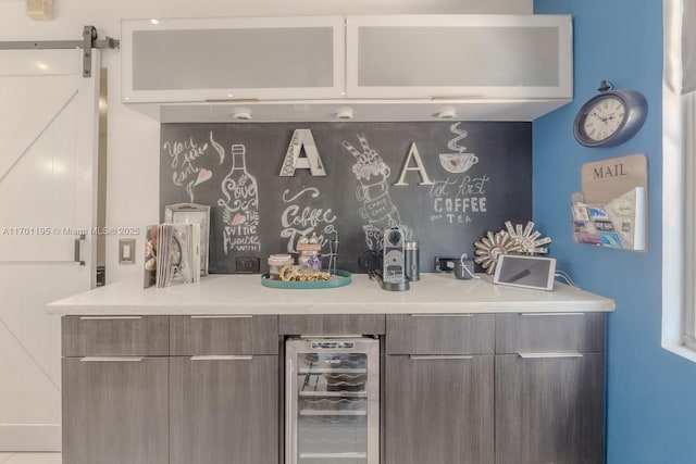 bar featuring a barn door and beverage cooler