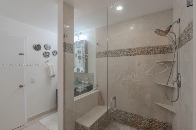 bathroom with a shower with shower door