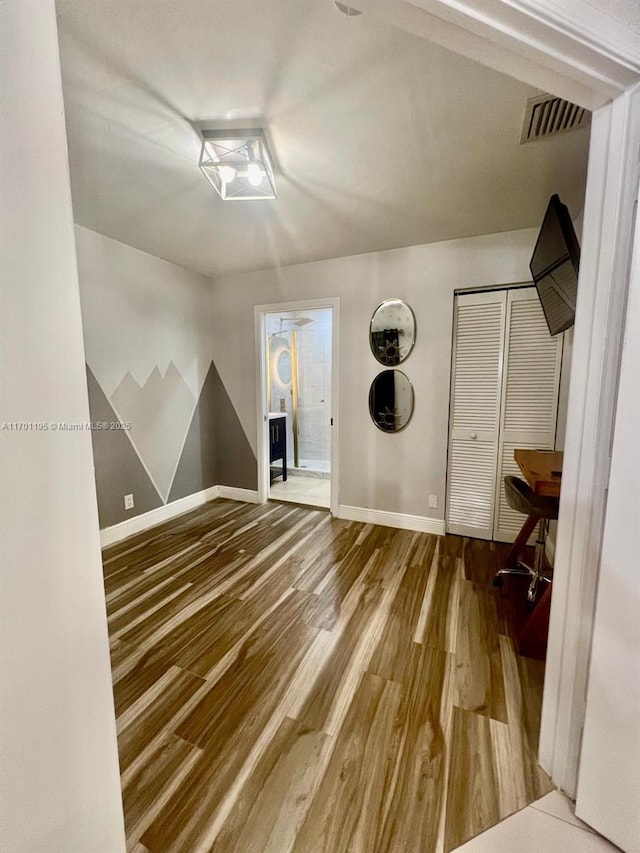 clothes washing area with hardwood / wood-style floors