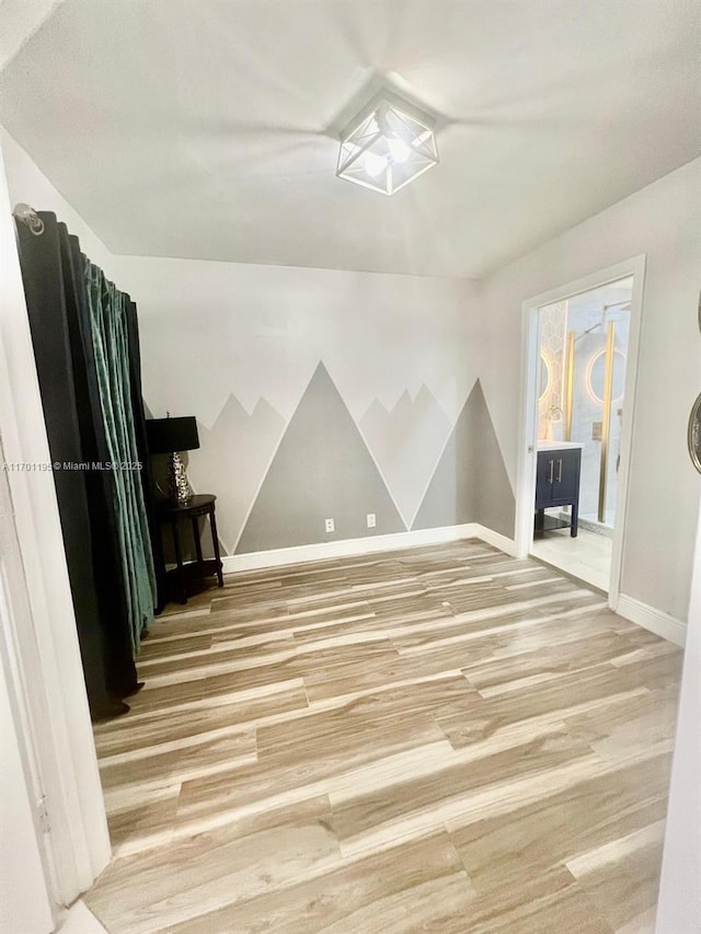 spare room featuring hardwood / wood-style floors