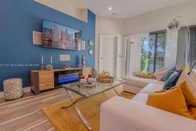 sitting room featuring light hardwood / wood-style floors