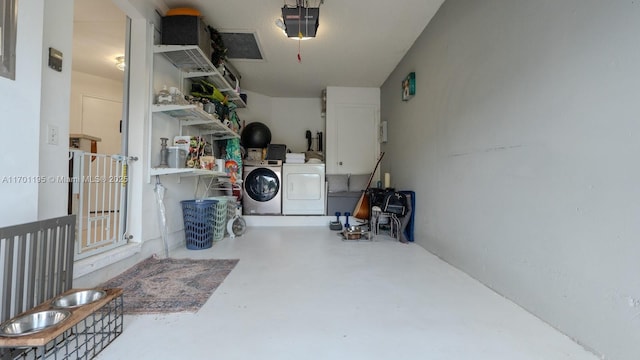 garage featuring a garage door opener and washing machine and clothes dryer