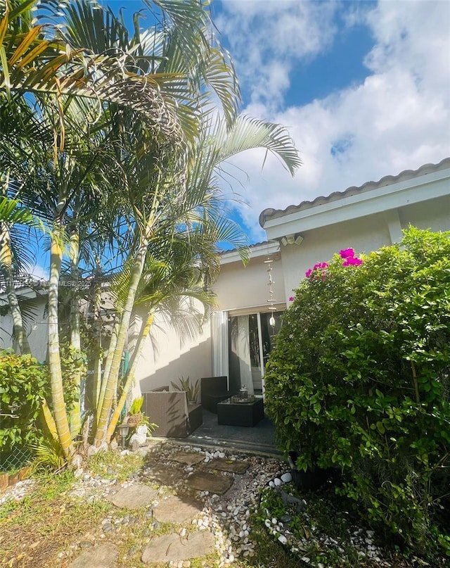 view of side of property with a patio