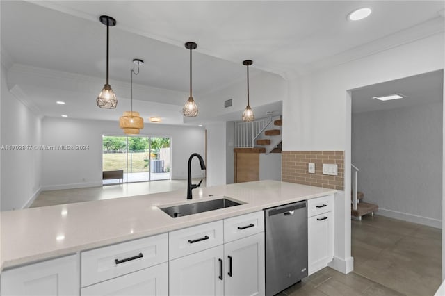 kitchen with white cabinets, stainless steel dishwasher, hanging light fixtures, and sink