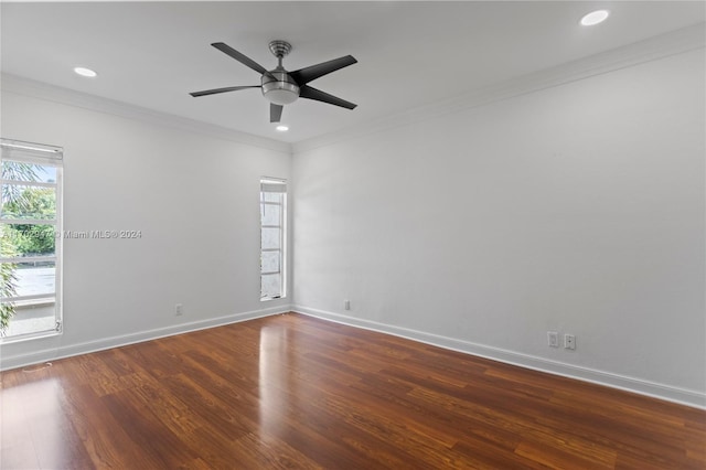 unfurnished room with dark hardwood / wood-style floors, ceiling fan, and ornamental molding