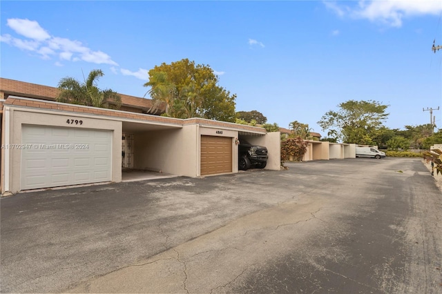 garage with a carport