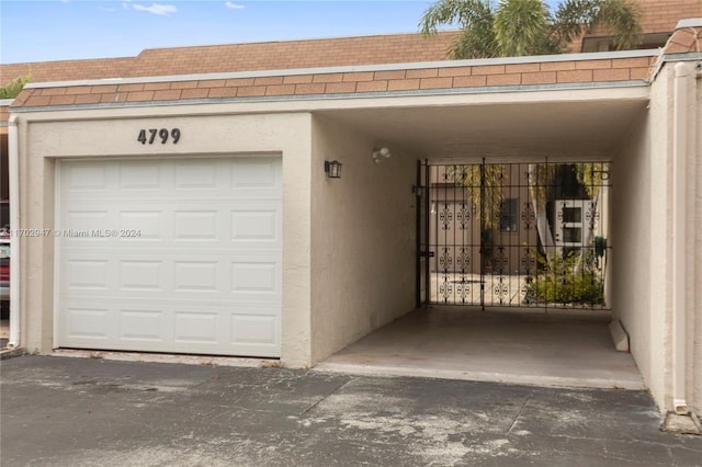 garage with a carport