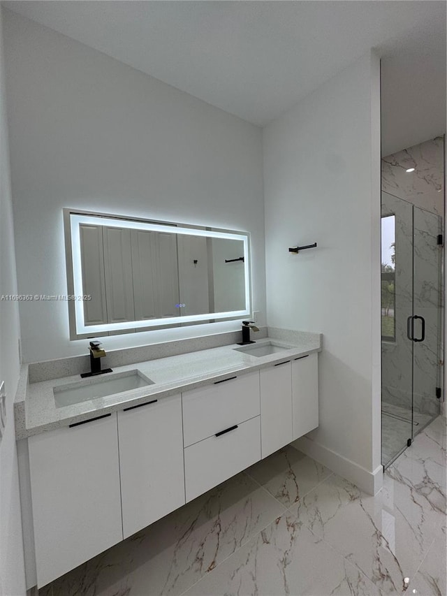 bathroom featuring vanity and an enclosed shower