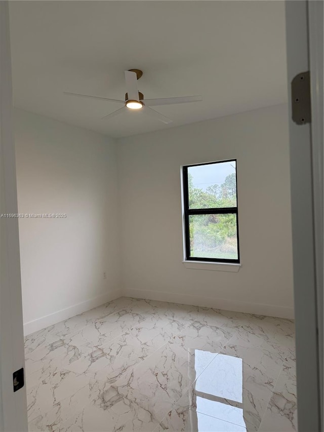 unfurnished room with ceiling fan