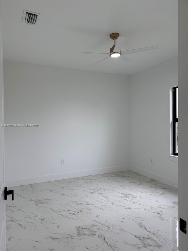 spare room featuring ceiling fan