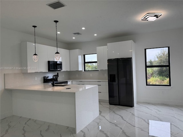 kitchen with black appliances, white cabinets, decorative backsplash, hanging light fixtures, and kitchen peninsula