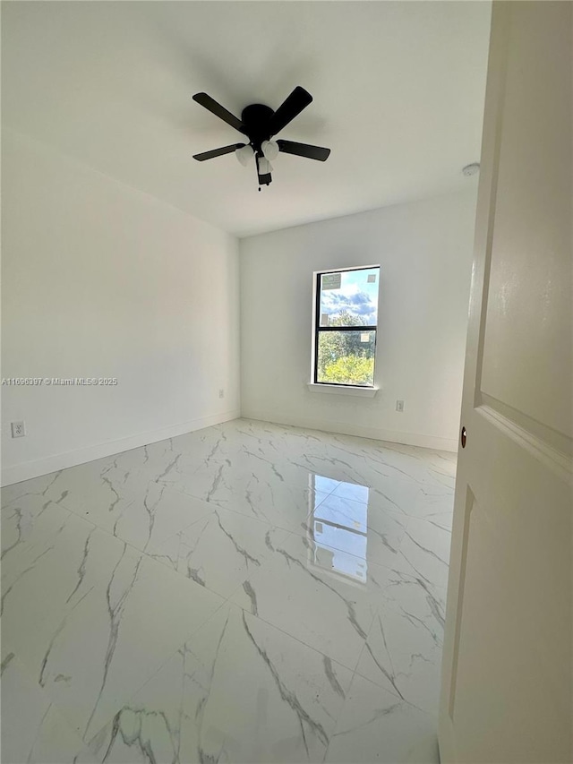 unfurnished room with ceiling fan