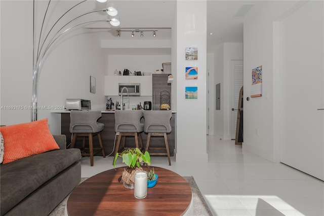 living room with light tile patterned floors