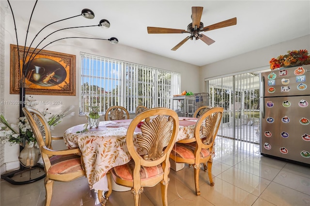 dining area with light tile patterned floors, a wealth of natural light, and ceiling fan