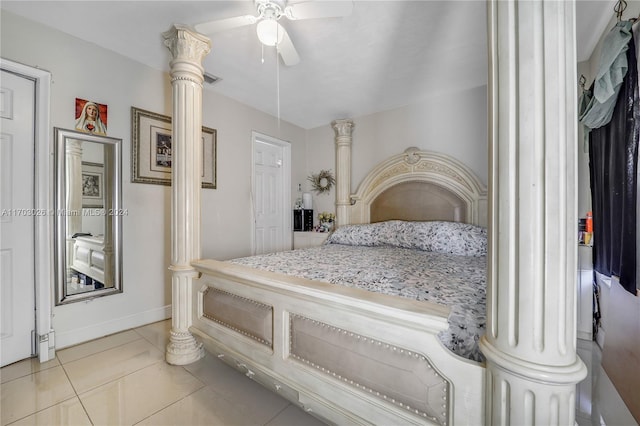 bedroom featuring decorative columns, ceiling fan, and light tile patterned floors