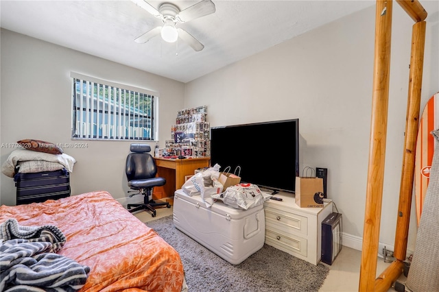 bedroom featuring ceiling fan and light carpet