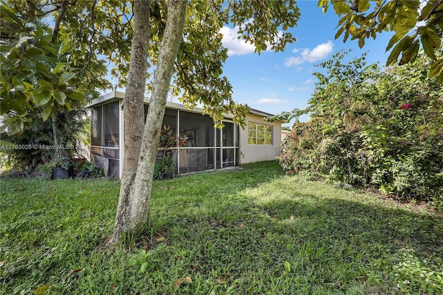 view of yard featuring a sunroom