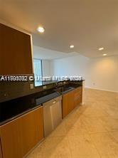 kitchen with dark countertops and recessed lighting