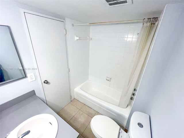 full bathroom with tile patterned floors, shower / bath combination with curtain, toilet, and vanity