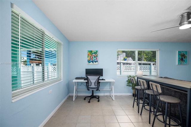 office area featuring light tile patterned floors and ceiling fan