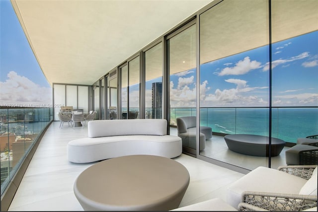 balcony featuring outdoor lounge area and a water view