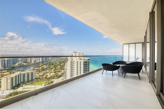 balcony featuring a water view