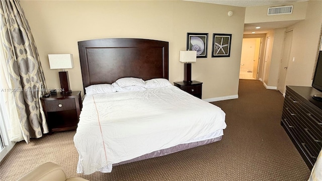 bedroom featuring dark colored carpet