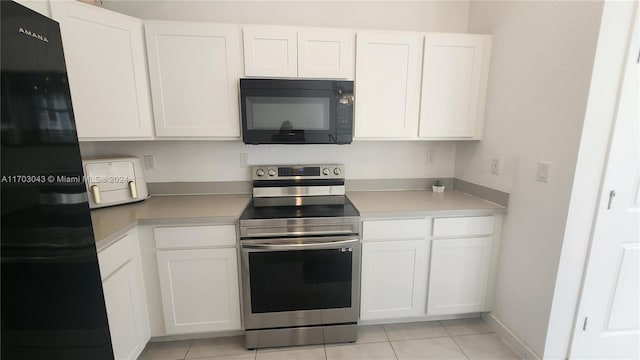 kitchen featuring black appliances, white cabinets, and light tile patterned floors