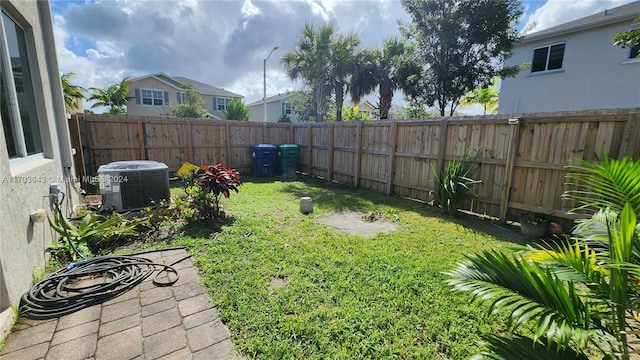 view of yard with central AC