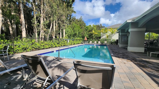 view of swimming pool featuring a patio area