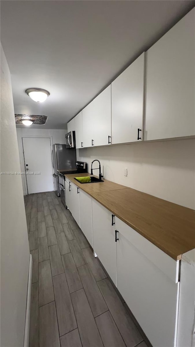 empty room featuring a healthy amount of sunlight and hardwood / wood-style flooring