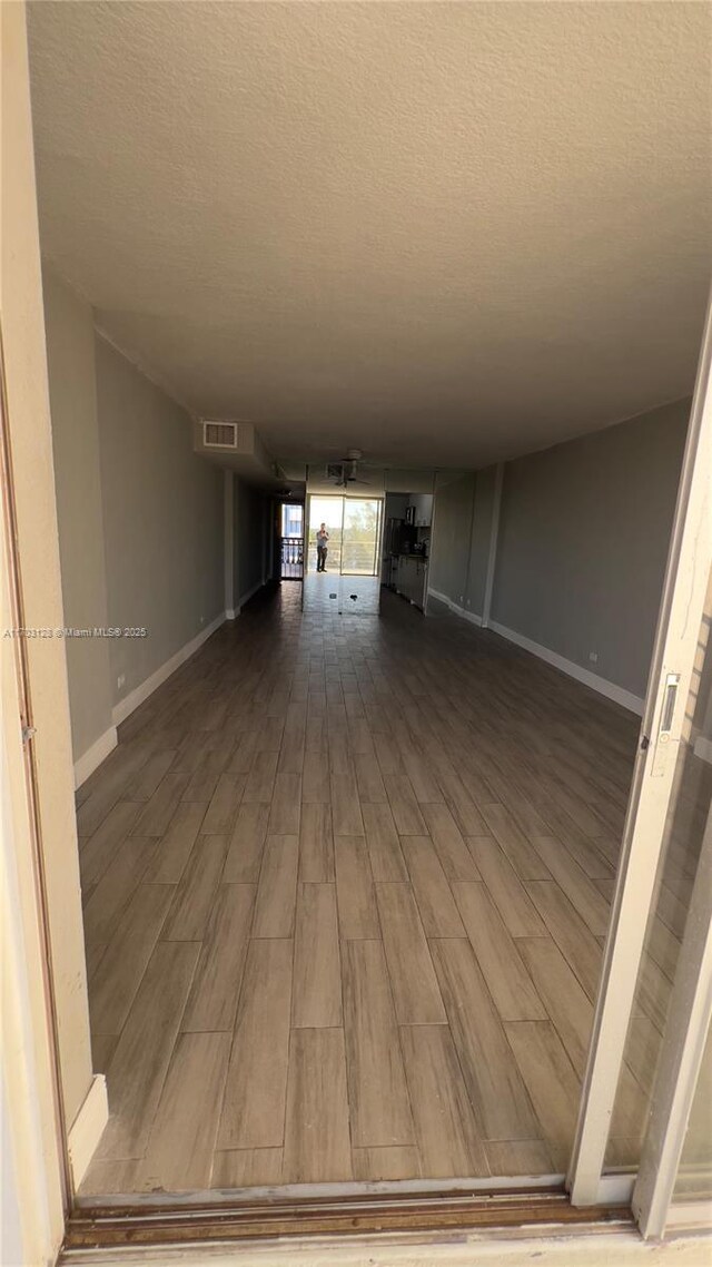 corridor with a textured ceiling