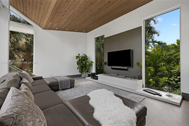 living room featuring wooden ceiling and vaulted ceiling